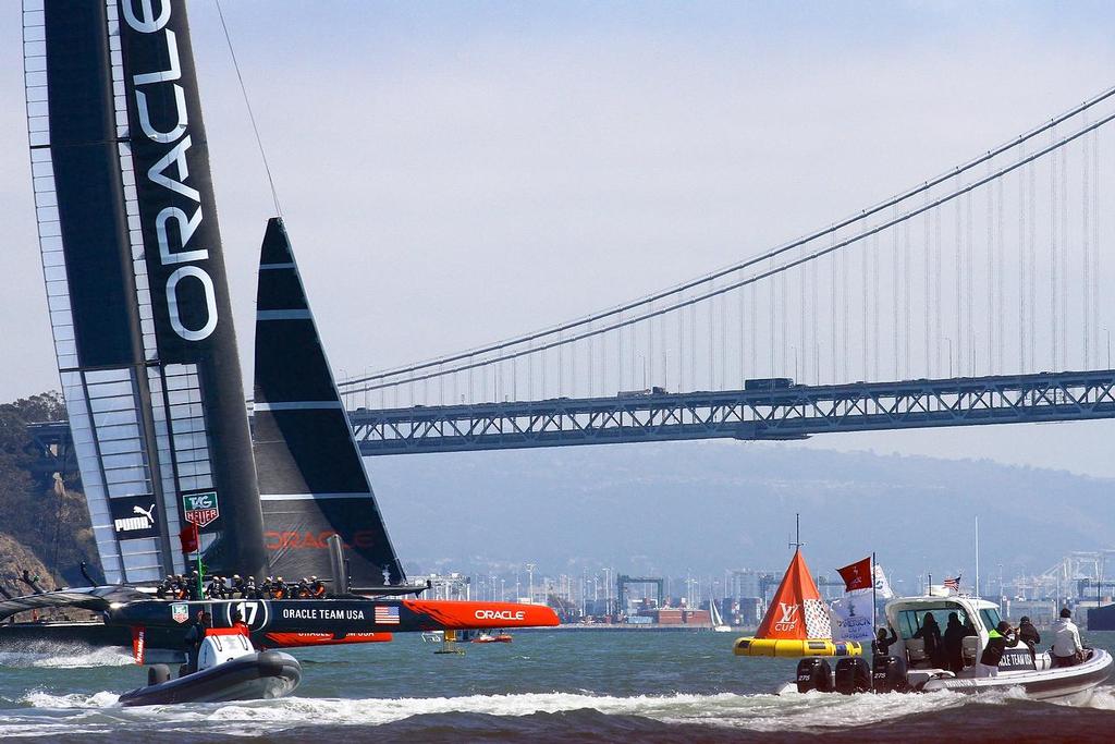 Oracle Team USA v Emirates Team New Zealand. America’s Cup Day 5 San Francisco. Oracle Team USA crosses the finish line in Race 8 © Richard Gladwell www.photosport.co.nz